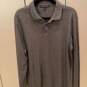 Men’s long sleeve knit polo style shirt in grey. Michael Kors. Metal buttons